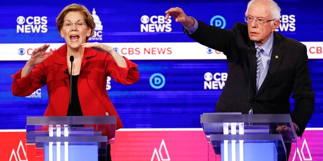 Democratic presidential candidates, Sen. Elizabeth Warren, D-Mass., left, and Sen. Bernie Sanders, I-Vt., right, participate in a Democratic presidential primary debate at the Gaillard Center, Tuesday, Feb. 25, 2020, in Charleston, S.C., co-hosted by CBS News and the Congressional Black Caucus Institute. (AP Photo/Patrick Semansky)