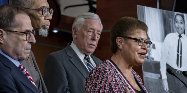 From left, House Judiciary Committee Chairman Jerrold Nadler, D-N.Y., Rep. Bobby Rush, D-Ill., House Majority Leader Steny Hoyer, D-Md., and Rep. Karen Bass, D-Calif., chair of the Congressional Black Caucus, hold a news conference to discuss the "Emmett Till Antilynching Act" which would designate lynching as a hate crime under federal law, on Capitol Hill in Washington, Wednesday, Feb. 26, 2020. Emmett Till, pictured at right, was a 14-year-old African-American who was lynched in Mississippi in 1955, after being accused of offending a white woman in her family's grocery store. (AP Photo/J. Scott Applewhite)