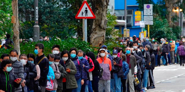 In this Feb. 5, 2020, file photo, citizens line up to buy face masks in Hong Kong. Fear of the spreading coronavirus has led to a global run on sales of face masks despite medical experts' advice that most people who aren't sick don't need to wear them. 