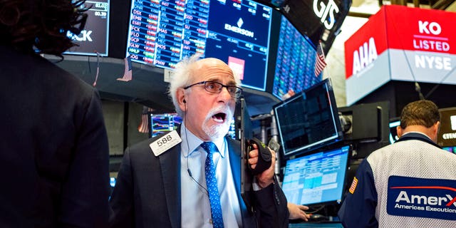 Trader Peter Tuchman works on the floor of the New York Stock Exchange Thursday, Feb. 27, 2020. 