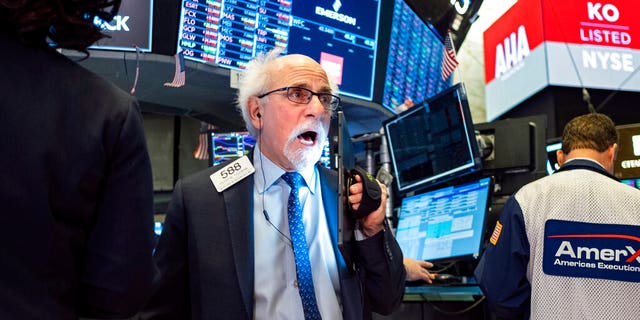 Trader Peter Tuchman works on the floor of the New York Stock Exchange Thursday, Feb. 27, 2020. 