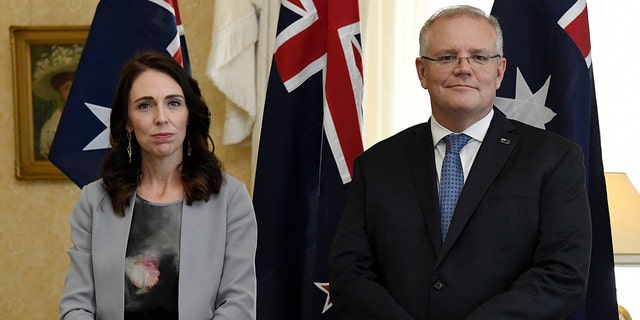 New Zealand Prime Minister Jacinda Ardern, left, stands with Australian Prime Minister Scott Morrison during the signing of the Indigenous Collaboration Arrangement at Admiralty House in Sydney, Friday, Feb. 28, 2020. (Bianca De Marchi/Pool Photo via AP)