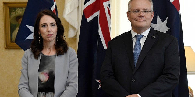 New Zealand Prime Minister Jacinda Ardern, left, stands with Australian Prime Minister Scott Morrison during the signing of the Indigenous Collaboration Arrangement at Admiralty House in Sydney, Friday, Feb. 28, 2020. (Bianca De Marchi/Pool Photo via AP)