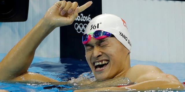 In this Monday, Aug. 8, 2016 file photo China's Sun Yang celebrates winning the final of the men's 200-meter freestyle during the swimming competitions at the 2016 Summer Olympics in Rio de Janeiro, Brazil.