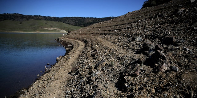 Water lines are visible along the banks of the Anderson Reservoir on February 25, 2020 in Morgan Hill, California.
