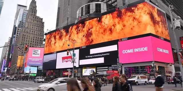 The message displayed in Times Square read "Imagine fighting a bush fire higher than this billboard" before being engulfed in flames.