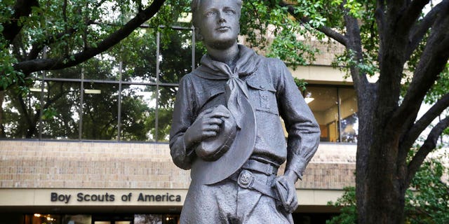 A statue stands outside the Boys Scouts of America headquarters in Irving, Texas, on Feb. 12. The Boy Scouts of America has filed for bankruptcy protection as it faces a barrage of new sex-abuse lawsuits. The filing Tuesday, Feb. 18, in Wilmington, Delaware, is an attempt to work out a potentially mammoth compensation plan for abuse victims that will allow the 110-year-old organization to carry on. (AP Photo/LM Otero)