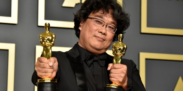 Writer-director Bong Joon-ho, winner of the Best Picture, Director, Original Screenplay, and International Feature Film awards for 'Parasite,' poses in the press room during the 92nd Annual Academy Awards at Hollywood and Highland on February 09, 2020 in Hollywood, Calif.