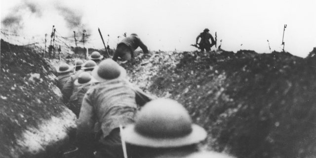 British soldiers leaving a trench to attack on the Somme, 1916.