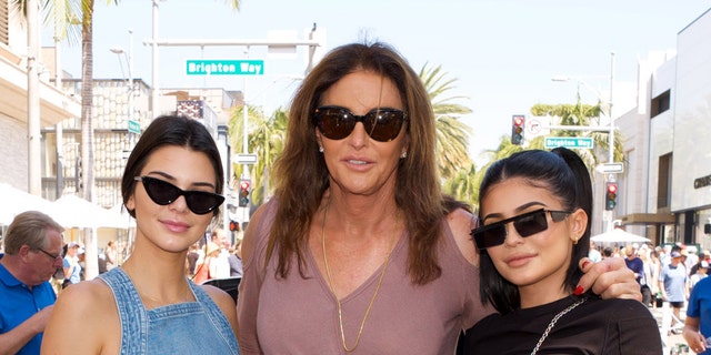 (L-R) Kendall Jenner, Caitlyn Jenner and Kylie Jenner pose for a photo as Caitlyn Jenner displays her Austin-Healey Sprite at the Rodeo Drive Concours d'Elegance on June 18, 2017 in Beverly Hills, Calif.