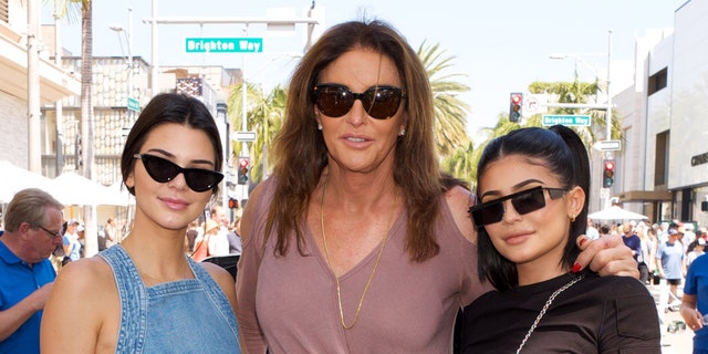 (L-R) Kendall Jenner, Caitlyn Jenner and Kylie Jenner pose for a photo as Caitlyn Jenner displays her Austin-Healey Sprite at the Rodeo Drive Concours d'Elegance on June 18, 2017 in Beverly Hills, Calif.