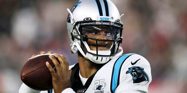 Aug. 22, 2019: Carolina Panthers quarterback Cam Newton warms up before an NFL preseason football game against the New England Patriots in Foxborough, Mass. (AP Photo/Charles Krupa)