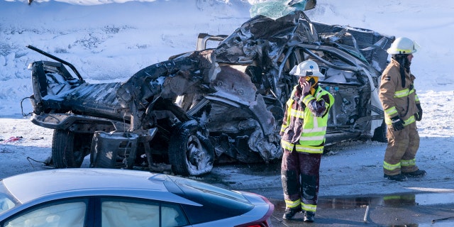 Emergency personnel gather at the scene following a multi-vehicle crash on the south shore of Montreal in La Prairie, Quebec, Wednesday, Feb. 19, 2020.
