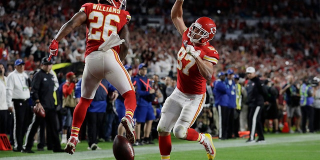 Kansas City Chiefs' Travis Kelce (87) celebrates his touchdown with Kansas City Chiefs' Damien Williams during the second half of the NFL Super Bowl 54 football game against the San Francisco 49ers, Sunday, Feb. 2, 2020, in Miami Gardens, Fla. (AP Photo/Lynne Sladky)