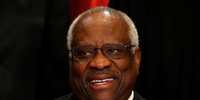 U.S. Supreme Court Justice Clarence Thomas participates in taking a new family photo with his fellow justices at the Supreme Court building in Washington, D.C., U.S., June 1, 2017. REUTERS/Jonathan Ernst - RC15CF6608B0