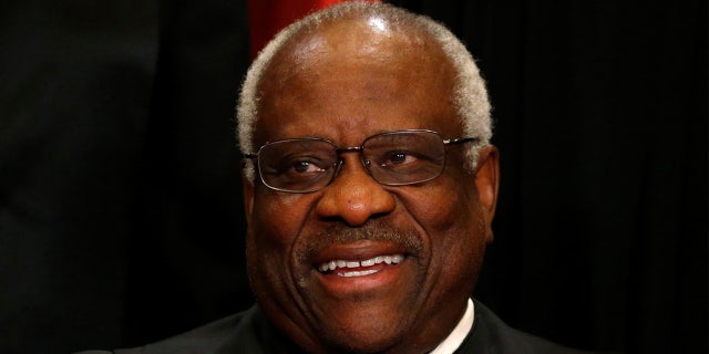 U.S. Supreme Court Justice Clarence Thomas participates in taking a new family photo with his fellow justices at the Supreme Court building in Washington, D.C., U.S., June 1, 2017. REUTERS/Jonathan Ernst - RC15CF6608B0