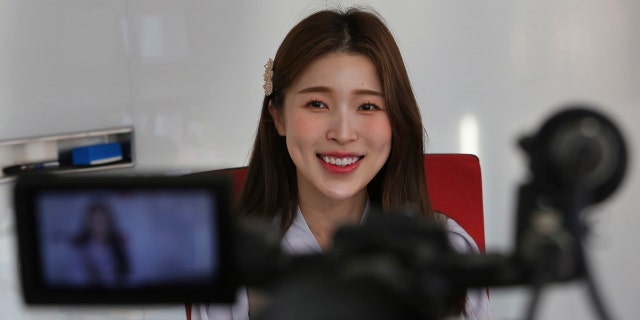 In this Thursday, Feb. 20, 2020, photo, Kang Na-ra, a Youtuber who defected in 2014, smiles during an interview in Seoul, South Korea. (AP Photo/Ahn Young-joon)