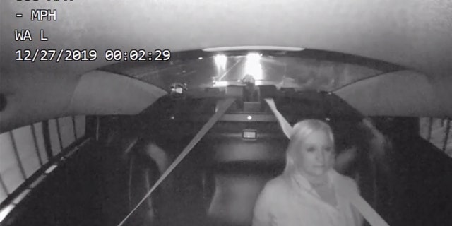 Image from a video showing Michigan state Rep. Rebekah Warren in the backseat of a patrol car after a drunk driving arrest on Dec. 26