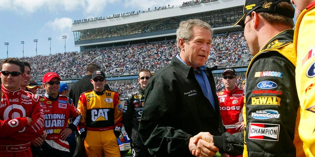 President George W. Bush greeted drivers in the pit at Daytona 500 NASCAR race in Daytona Beach, Fla., in 2004.  (AP Photo/Pablo Martinez Monsivais, File)
