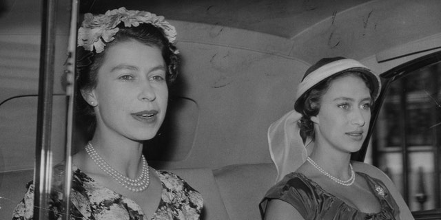 Queen Elizabeth II, left, and Princess Margaret. (Photo by PA Images via Getty Images)