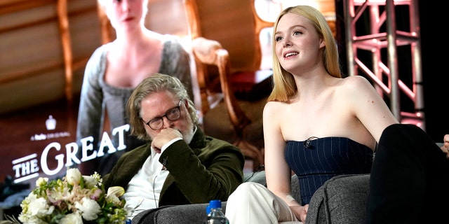 Tony McNamara, left, and Elle Fanning speak onstage during the Hulu Panel at Winter TCA 2020 at The Langham Huntington, Pasadena on January 17, 2020 in Pasadena, Calif. (Photo by Erik Voake/Getty Images for Hulu)