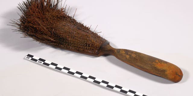 A hairbrush was discovered in one of the officer's cabins on the HMS Erebus. Some human hairs were recovered from the bristles. DNA analysis may identify the brush's owner. (Parks Canada)