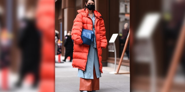 Marina Ingvarsson is seen wearing an orange puffer coat and blue bag outside the Michael Kors show during New York Fashion Week: A/W20 on February 12, 2020 in New York City. (Photo by Daniel Zuchnik/Getty Images)