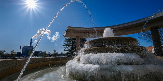 Cold temperatures turned the fountain in front of the Southern Illinois University, Student Services Building into a partial ice sculpture, Friday morning, Feb. 14, 2020, in Carbondale, Ill.