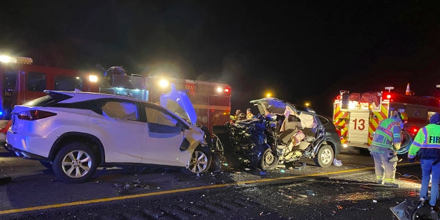 First responders from the Midway Fire Department survey the scene of a fatal accident on Interstate 95, which claimed the lives of multiple people, early Sunday morning, Feb. 23, 2020, in Liberty County, Ga.