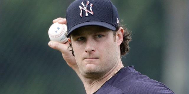 New York Yankees' Gerrit Cole throws to first base during a spring training baseball workout Thursday, Feb. 13, 2020, in Tampa, Fla. (AP Photo/Frank Franklin II)