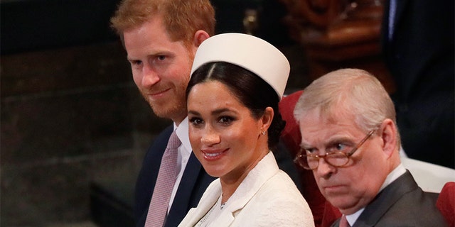 (L-R) Britain's Prince Harry, Duke of Sussex, Britain's Meghan, Duchess of Sussex and Britain's Prince Andrew, Duke of York.