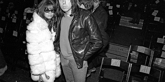 Johnny Ramone (R) and wife Linda pose for a photo during fashion week in 1994 in New York City.