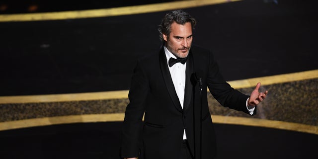 "We feel entitled to artificially inseminate a cow, and when she gives birth, we steal her baby," Phoenix said after winning the Oscar for best actor. (Photo by Kevin Winter/Getty Images)