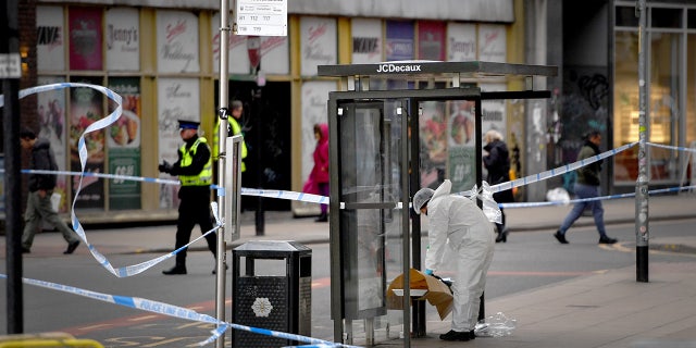 A forensic officer is seen at work following a reported stabbing at Manchester Piccadilly Gardens on February 10, 2020 in Manchester, England. (Photo by Anthony Devlin/Getty Images)