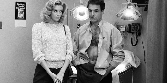 Pictured: (l-r) Nancy Stafford as Joan Halloran, Mark Harmon as Doctor Robert Caldwell in 'St. Elsewhere.'