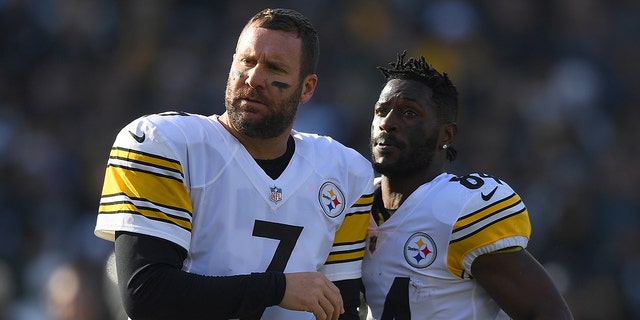 Antonio Brown (No. 84) and Ben Roethlisberger (No. 7) of the Pittsburgh Steelers looks on against the Oakland Raiders during the first half of their NFL football game at Oakland-Alameda County Coliseum on Dec. 9, 2018, in Oakland, Calif. (Photo by Thearon W. Henderson/Getty Images)