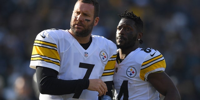 Antonio Brown (No. 84) and Ben Roethlisberger (No. 7) of the Pittsburgh Steelers looks on against the Oakland Raiders during the first half of their NFL football game at Oakland-Alameda County Coliseum on Dec. 9, 2018, in Oakland, Calif. (Photo by Thearon W. Henderson/Getty Images)