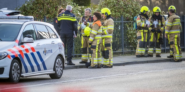 Emergency services stand outside a postal sorting company after a bomb letter is believed to have detonated in the mailroom in the southern city of Kerkrade on February 12, 2020. (Photo by MARCEL VAN HOORN/ANP/AFP via Getty Images)