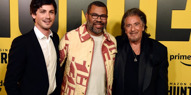 Jordan Peele, center, executive producer of the Amazon Prime Video series "Hunters," poses with cast members Logan Lerman, left, and Al Pacino at the premiere of the show at the Directors Guild of America, Wednesday, Feb. 19, 2020, in Los Angeles.