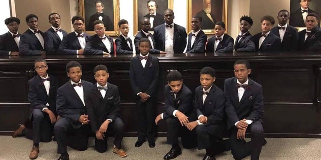 Young men, grades 6-9, are in the Impact Agency's mentorship program to change their school and community for the better.