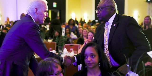Democratic presidential candidate former Vice President Joe Biden, left, shakes hands with House Majority Whip James Clyburn, D-S.C., at the First in the South Dinner, Monday, Feb. 24, 2020, in Charleston, S.C. 