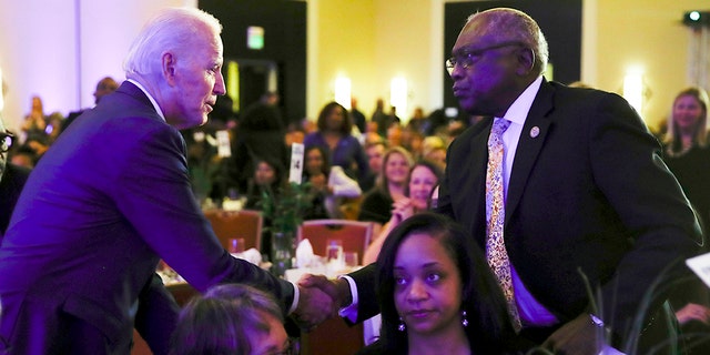 Democratic presidential candidate former Vice President Joe Biden, left, shakes hands with House Majority Whip James Clyburn, D-S.C., speaks at the First in the South Dinner, Monday, Feb. 24, 2020, in Charleston, S.C. (AP Photo/Matt Rourke)