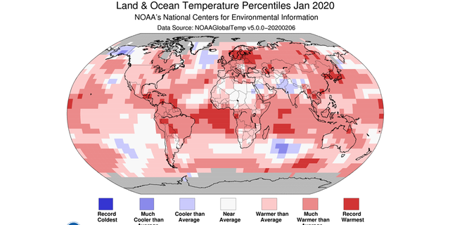 A man from NOAA's National Centers for Environmental Information showing the scope of warmer-than-average temperatures across the globe in January 2020.