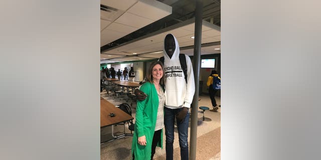 Storm Lake Schools Superintendent Stacey Cole, seen with a high school student, says the kids in her district have welcomed each other.