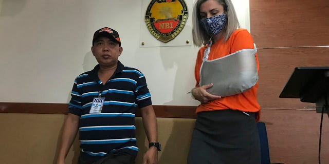 Talbot was presented to reporters in Manila for the second time on Wednesday after being accused of trying to smuggle a newborn baby out of the country. (AP Photo/Vicente Gonzales)