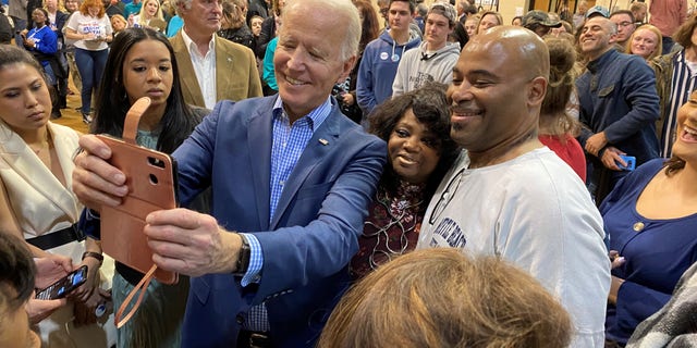 Former Vice President Joe Biden takes selfies with voters at a town hall in Conway, S.C., on Feb. 27, 2020. (Fox News)