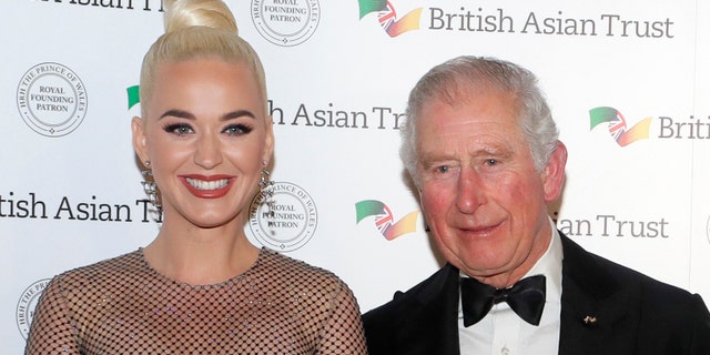 Prince Charles, Prince of Wales, Royal Founding Patron of the British Asian Trust poses with American musician Katy Perry as they arrive to attend a reception for supporters of the British Asian Trust on Feb. 4, 2020.