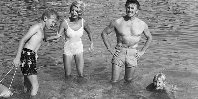 Kirk Douglas his wife Anne and their two children Eric and Peter in Monaco in 1967. (Photo credit should read AFP/AFP via Getty Images)