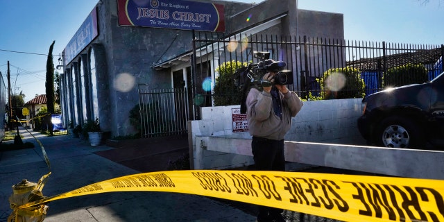 In this Wednesday, Jan. 29, 2020, file photo, crime scene tape is seen closing off an area around the grounds of the Kingdom of Jesus Christ Church in the Van Nuys section of Los Angeles. (AP Photo/Richard Vogel, File)