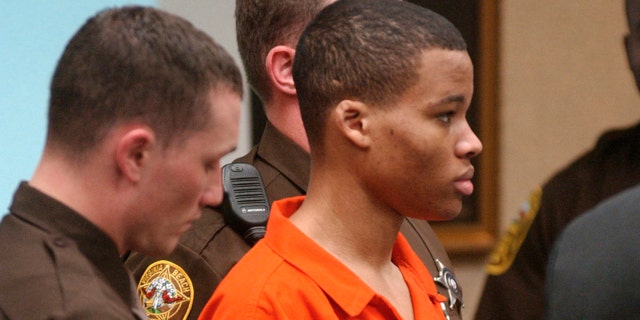 Lee Boyd Malvo listens to court proceedings during the trial of fellow sniper suspect John Allen Muhammad in Virginia Beach, Virginia Oct. 20, 2003. 